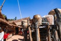 Ancient salt pits showing platform, earthenware water jars, souvenirÃ¢â¬â¢ salt stand behind. Ancient method of boiling brine into Royalty Free Stock Photo